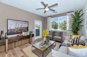 a living room with a couch and a ceiling fanat Weylyn Luxury Apartments, Arizona